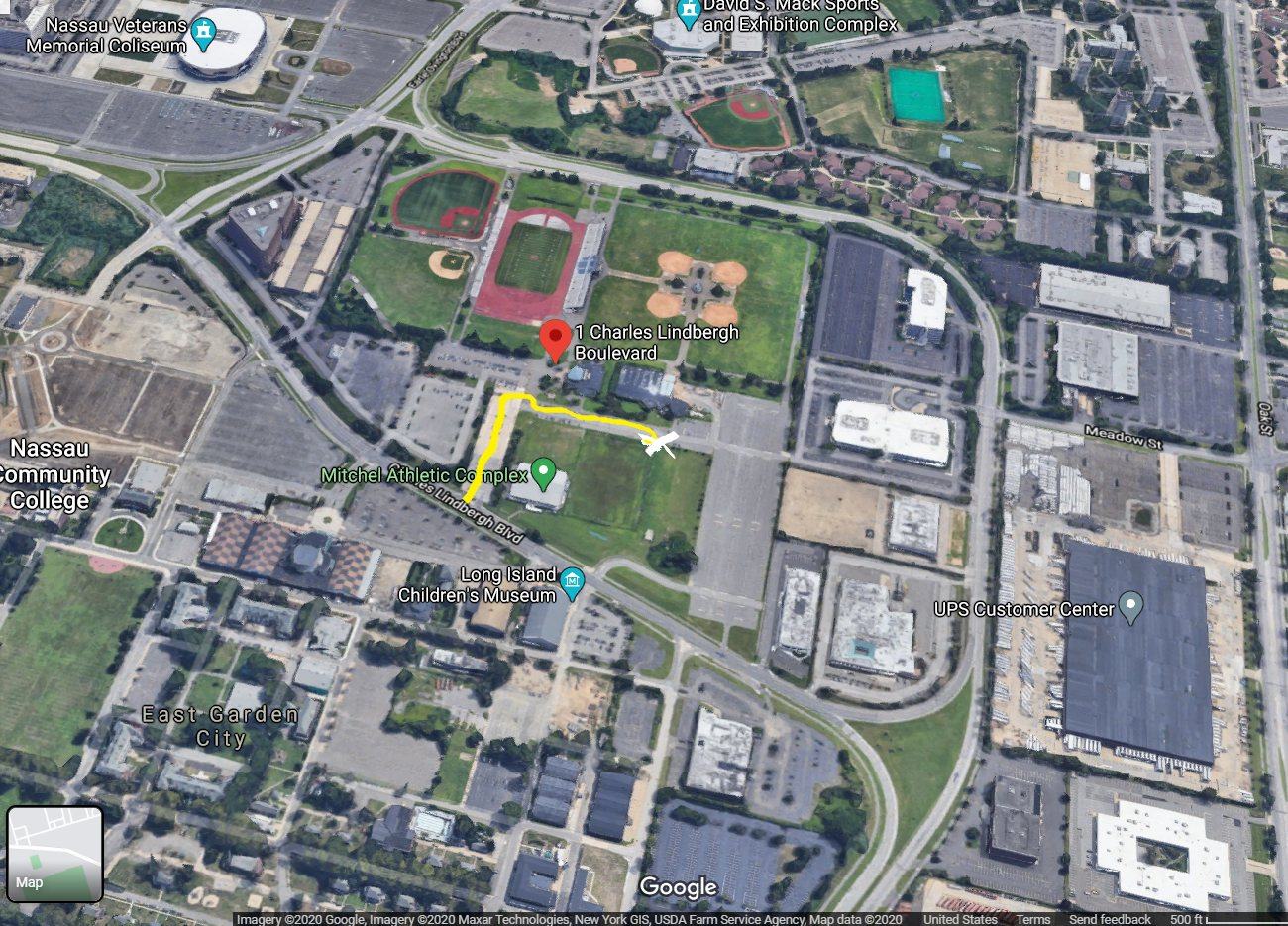 Aerial view of the Mitchel Athletic Complex in Uniondale with a yellow line showing the route from Charles Lindbergh Boulevard to the range building.